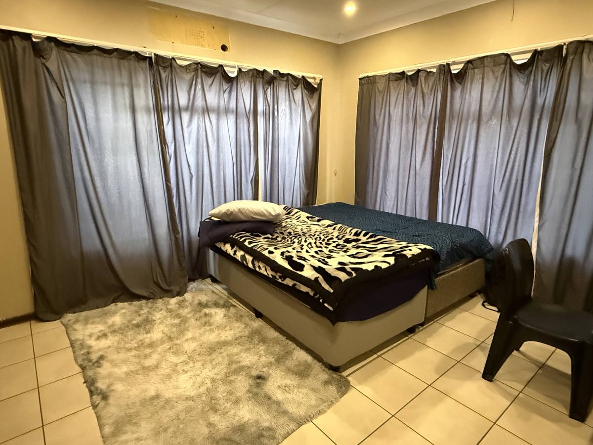 Bedroom — single room with bed and chair